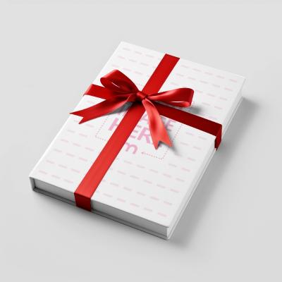 Gift Book Cover Mockup Wrapped on Red Ribbon on White Background